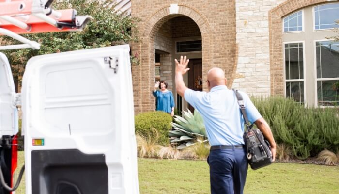 TemperturePro technician waving to customer needding AC repair service